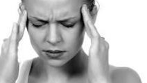 Woman experiencing a chronic headache