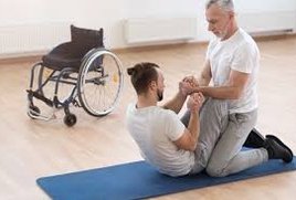 Physical Therapist assisting patient to curl up