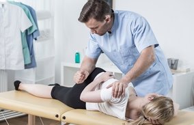 Manual Therapy on hip and back of patient