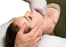 TMJ treatment perfomed on woman with Jaw dysfunction