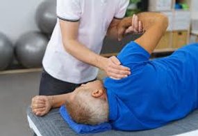 Stretching preformed on shoulder by licensed physical therapist.