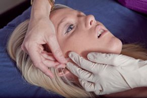 Dry Needling for TMJ and Face Pain perfomed on woman