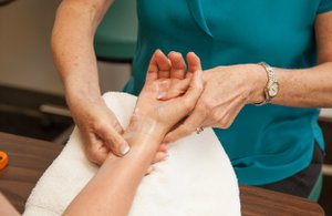 Manual Therapy on patient's wrist.