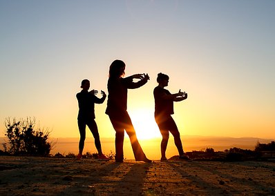 Three woman doing Tai Chi