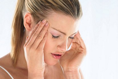 Woman with Headache holding sides of her head