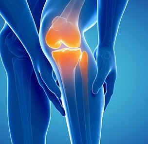 Hands holding knee in pain