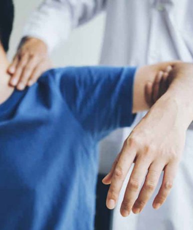 Shoulder stretching by physical therapist