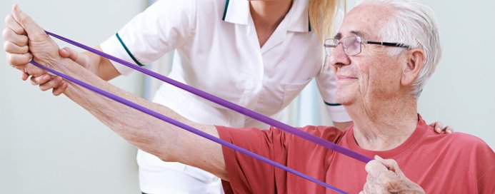 Band exercise performed by patient with assitance